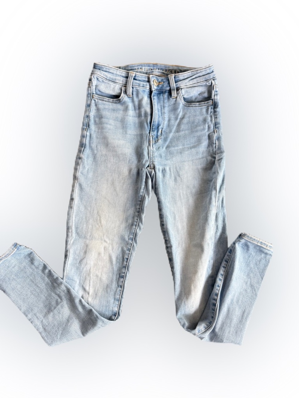 American Eagle Women’s  Next Level Stretch Distresses Light Wash Jeans. Size 0